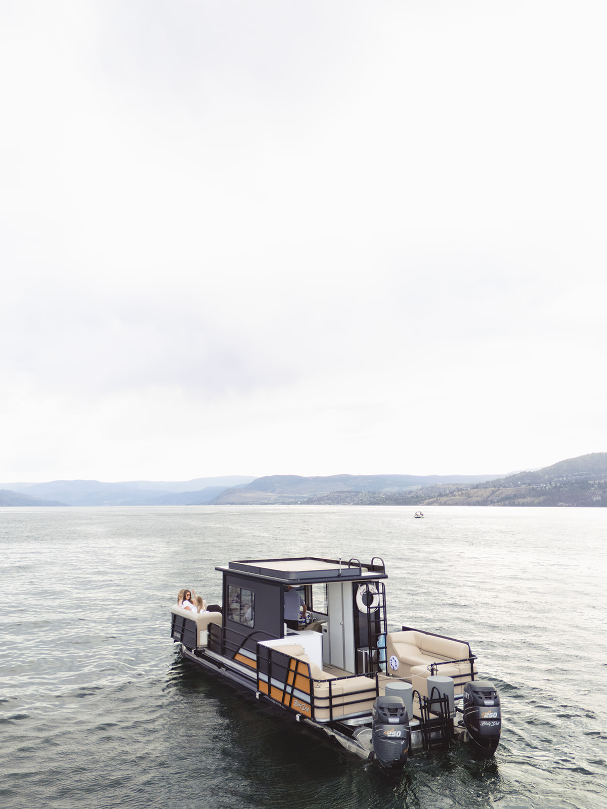 Baby Doll viewed from the stern with twin outboards and aft seating.